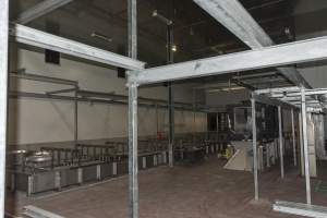 New killing/processing building containing large long scalding tank - Under construction at time of photos (2015). Gondolas much larger to gas many more pigs at once. Side of chamber opens, wall closes in to push pigs into gondola. - Captured at Diamond Valley Pork, Laverton North VIC Australia.