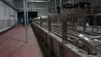 New killing/processing building containing large long scalding tank - Under construction at time of photos (2015). Gondolas much larger to gas many more pigs at once. Side of chamber opens, wall closes in to push pigs into gondola. - Captured at Diamond Valley Pork, Laverton North VIC Australia.