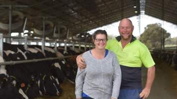 Farmers pose in intensive dairy shed - The Clymo's (