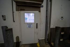 Door into kill room - Sign says 'SLAUGHTER FLOOR HIDE ON ENTRY' - Captured at Ralphs Meat Co, Seymour VIC Australia.